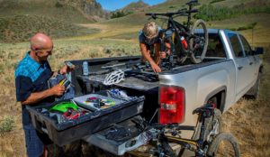 Truck with DECKED slide and drawers giving mountain bikers easy access to bikes and gear.