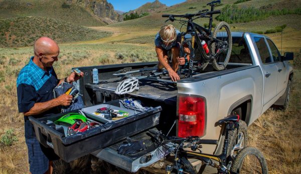 Truck with DECKED slide and drawers giving mountain bikers easy access to bikes and gear.