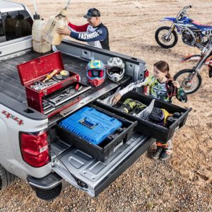 Truck with DECKED CargoGlide Truck Bed System and Drawer System at dirtbike staging area.