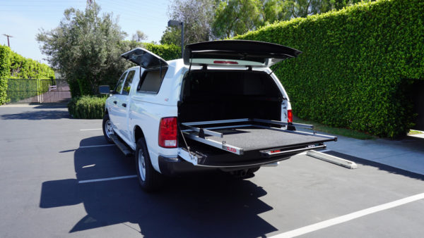 Customized Commercial Truck Upfitted by American Trucks and Vans using BEDSLIDE and SnugPro Camper Shell from SNUGTop.
