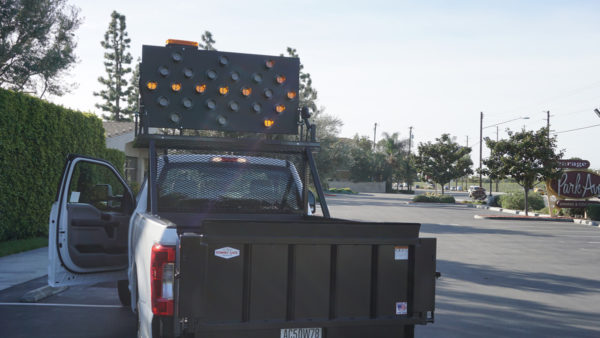 Fleet Work Truck Upfitted by American Trucks and Vans includes a Whelen Truck Mounted Arrow Light Panel and Tommy Gate Hydraulic Lift.