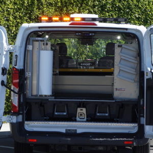 Shelving for cargo van with Ranger system, DECKED drawers, and Whelen light bar.