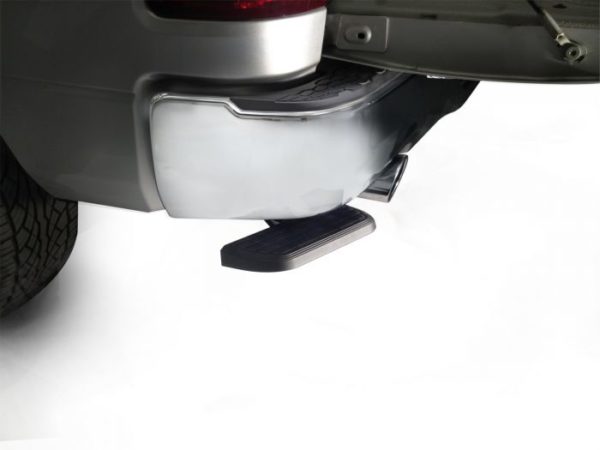 Retractable AMP Research BedStep mounted on vehicle to provide easy access to truck bed.