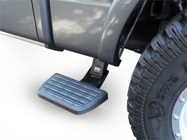 AMP Research BedStep mounted between the cab and rear tire, providing access to the truck bed.