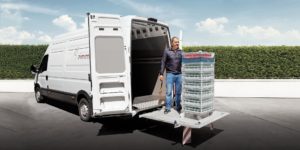 Palfinger Minifix ramp on cargo van with man operating lift.