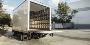 Box truck with Palfinger lift ramp for equipment loading.