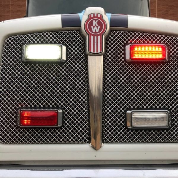 This Class 8 truck includes auxiliary grille lighting: white and red LED bars with red/clear lights.