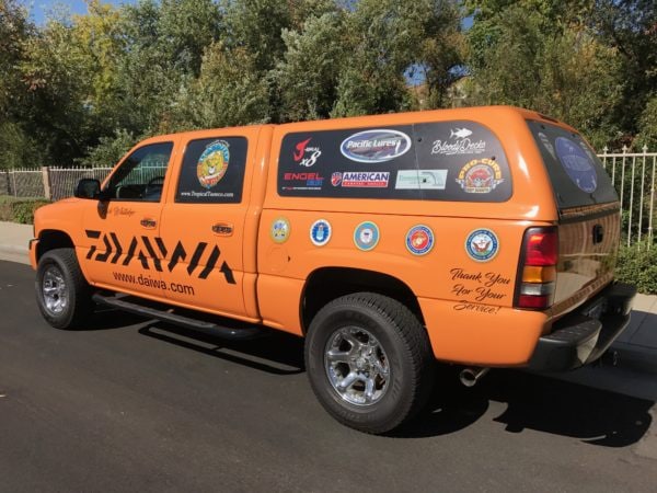 Daiwa Brand Truck Upfitting with Snugtop Camper Shell by American Trucks and Vans.
