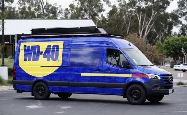 WD-40 work van with full vehicle wrap and custom exterior upgrades.