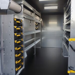 Work van interior with Ranger Design shelving, bins, locking cabinet, bulkhead, transport tube, and tool holders for organized storage.