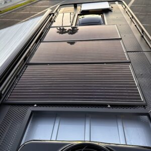 Mercedes 3500 AD 4×4 van equipped with Zamp Solar roof‑mounted panel and side awning.