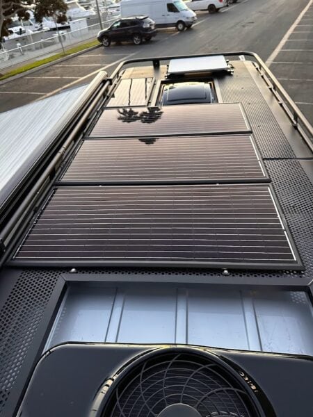 Mercedes 3500 AD 4×4 van equipped with Zamp Solar roof‑mounted panel and side awning.