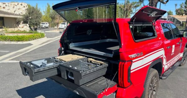 Huntington Beach Lifeguard vehicle with SnugTop shell and DECKED drawers — part of our Work Trucks and Vans builds.