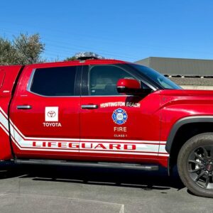 SnugTop camper shell installed on a Huntington Beach Lifeguard pickup truck by American Trucks & Vans for secure coastal equipment storage and daily service use.