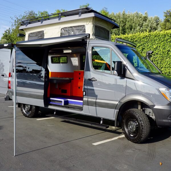 Recreational Van with AMP Research Power Step Customized by American Trucks & Vans