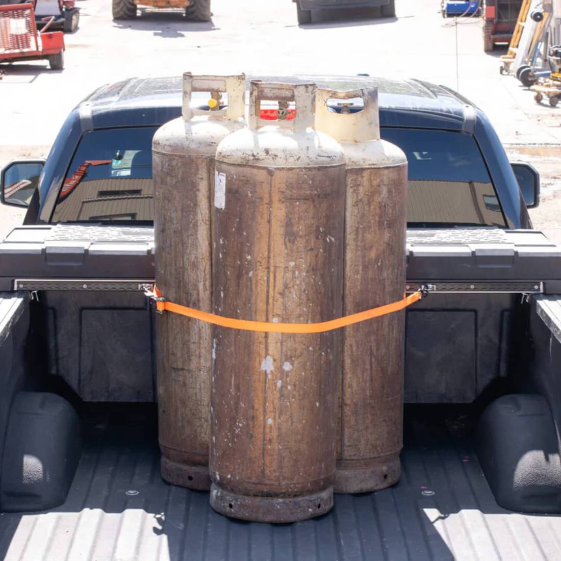 Core Trax-7 Cargo Tie Down Solution Holding Tanks Next to Decked Toolbox