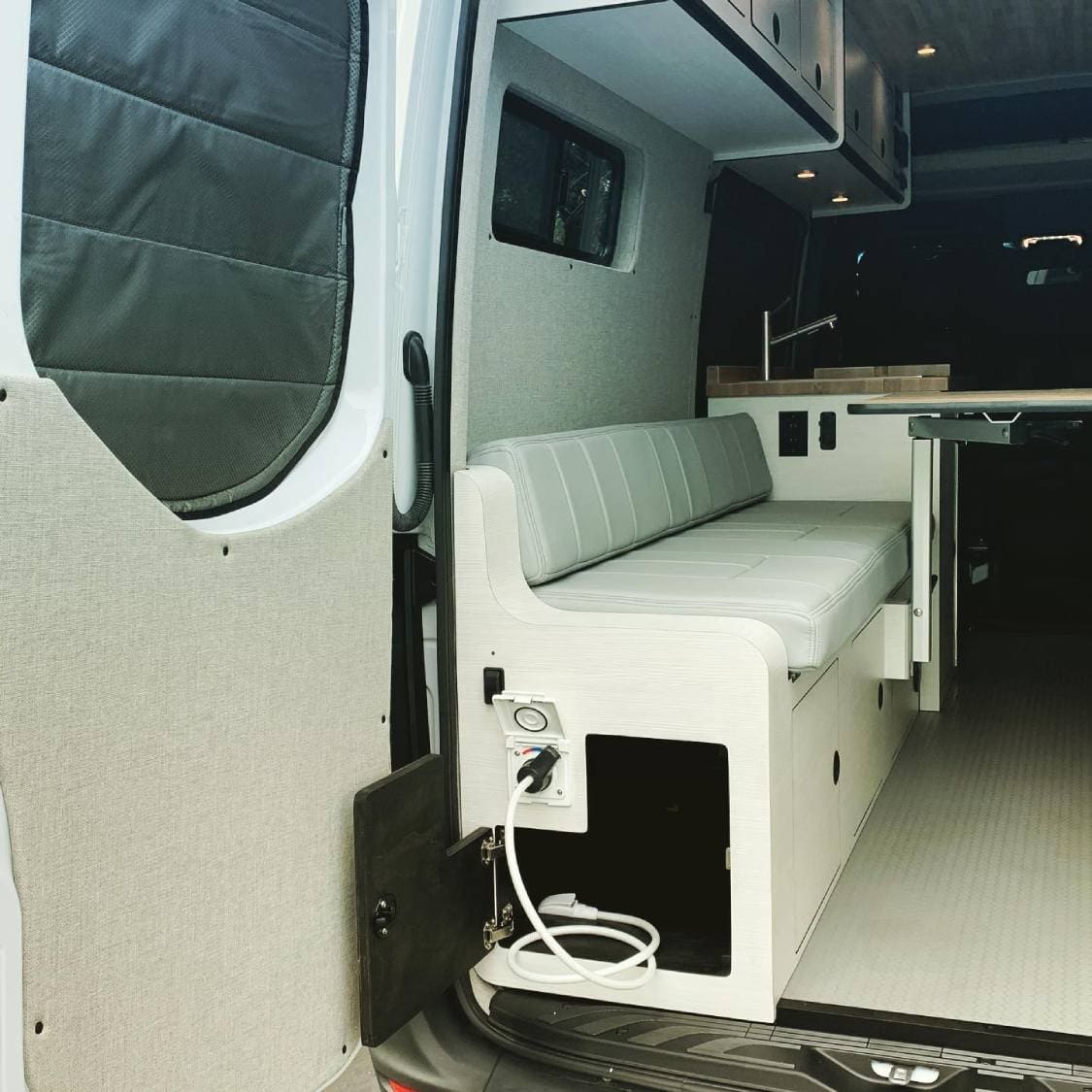 Rixen Hydronic Hot Water System with Shower Sprayer Under Van Sofa Bed