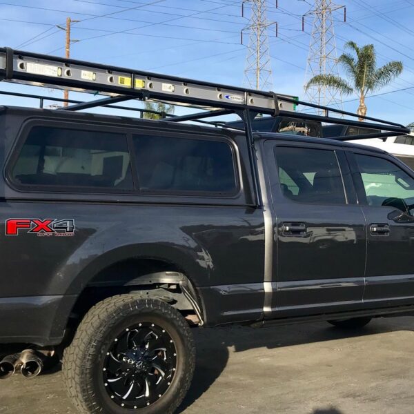Black Maxx Ladder Rack over LEER 100XR on Ford Custom Truck Installed by American Trucks and Vans