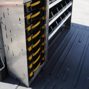 Plumbing van upfit with storage and non slip floor.