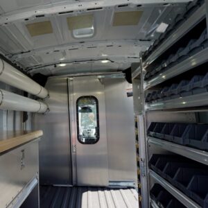 Interior of a plumbing van showing Ranger shelving and organization bins.