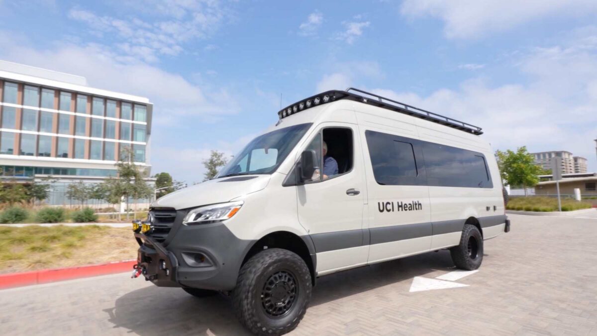 Mobile health clinic van for UCI Medical Center driving to a community outreach event