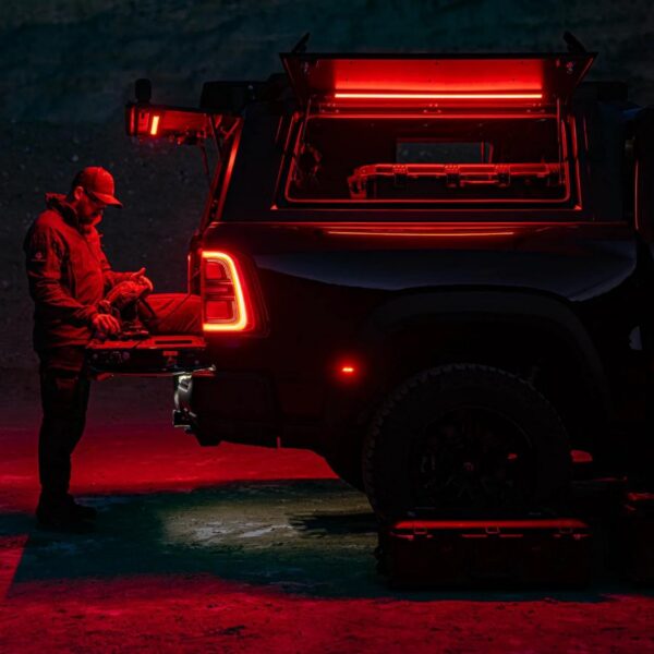 Kingpin Lighting red light inside camper shell with tailgate down at night