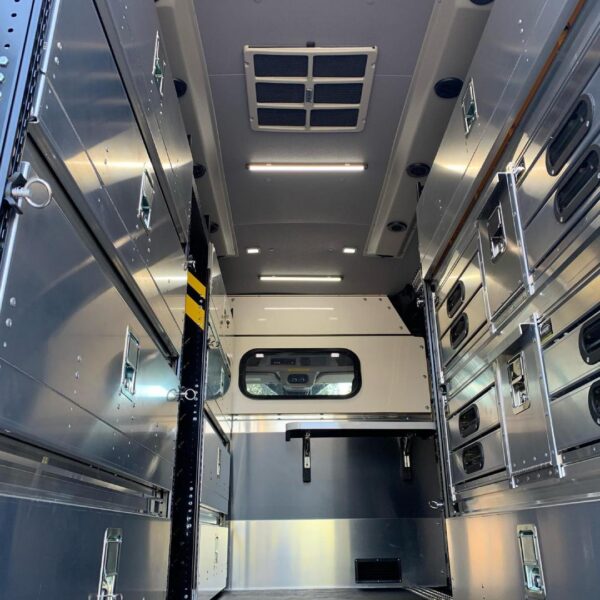 Kingpin Lighting in custom CSI van build with cabinet and task lighting