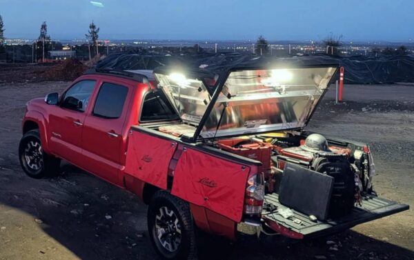 Kingpin lighting installed to illuminate truck bed