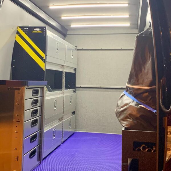 Kingpin Lighting illuminating shelves in mobile display van setup