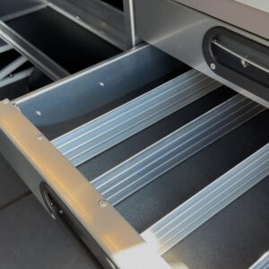 Top view of locksmith van upfit drawer system with open drawer and internal dividers for organization