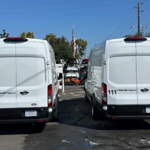 Locksmith van upfit on Ford Transit high roof vans parked at American Trucks and Vans