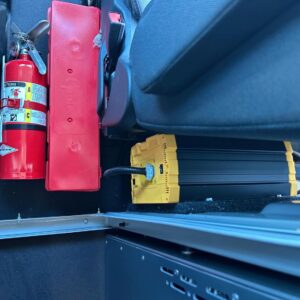 Go Power inverter by Dometic installed behind partition in locksmith van upfit with fire extinguisher and safety kit