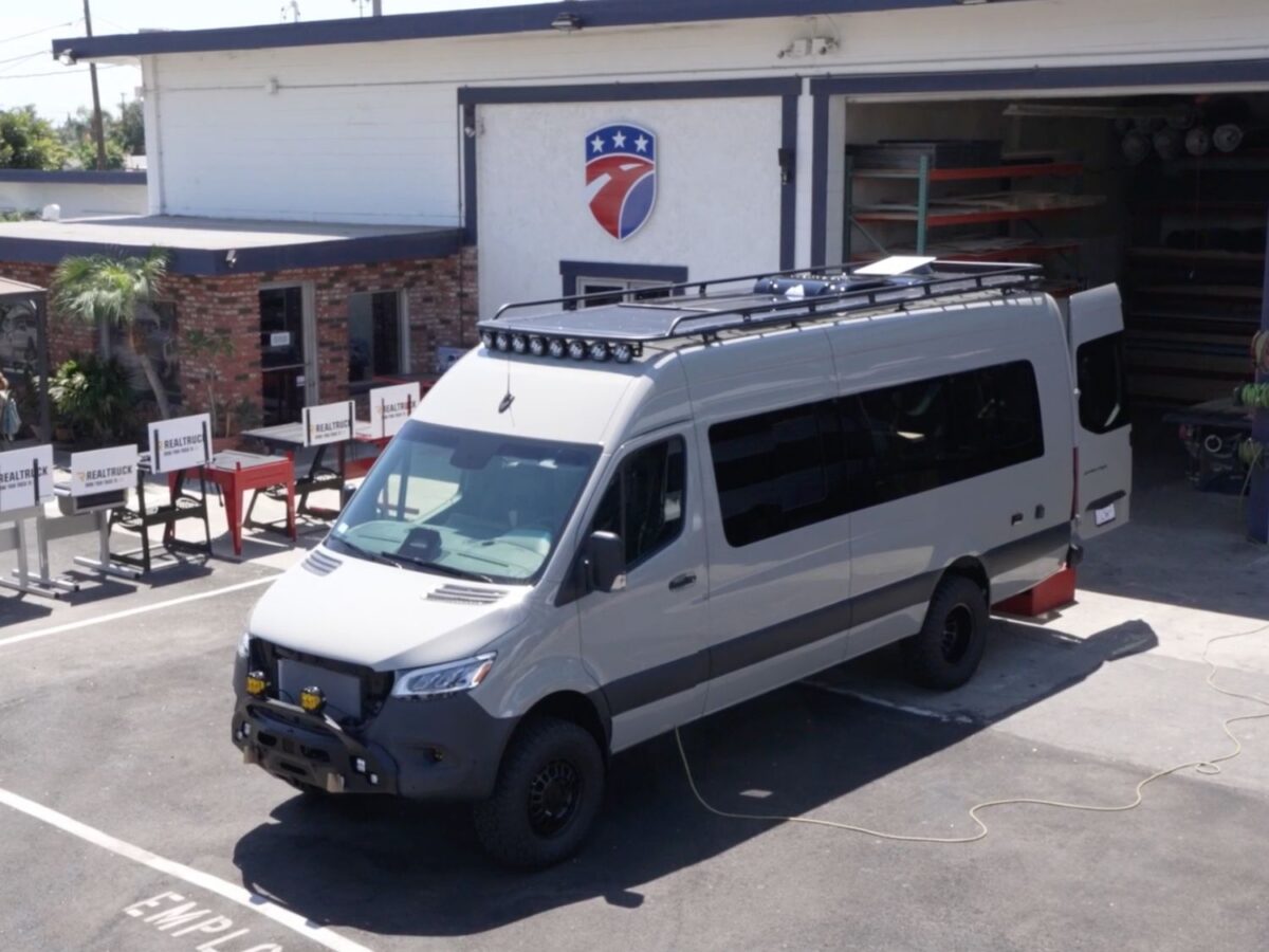 Completed mobile health clinic van for UCI Medical Center parked in front of American Trucks and Vans facility