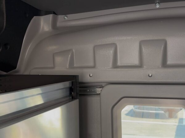 Close-up of the upper corner detail on a Sortimo ProPartition Light partition showing precise factory-style fit and finish.