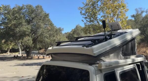 Flexible solar panels mounted above the pop-top roof of Gabby’s Volkswagen Eurovan