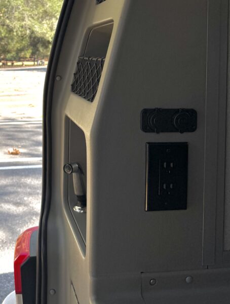 AC outlets and covered 12-volt power ports installed inside Gabby’s Volkswagen Eurovan